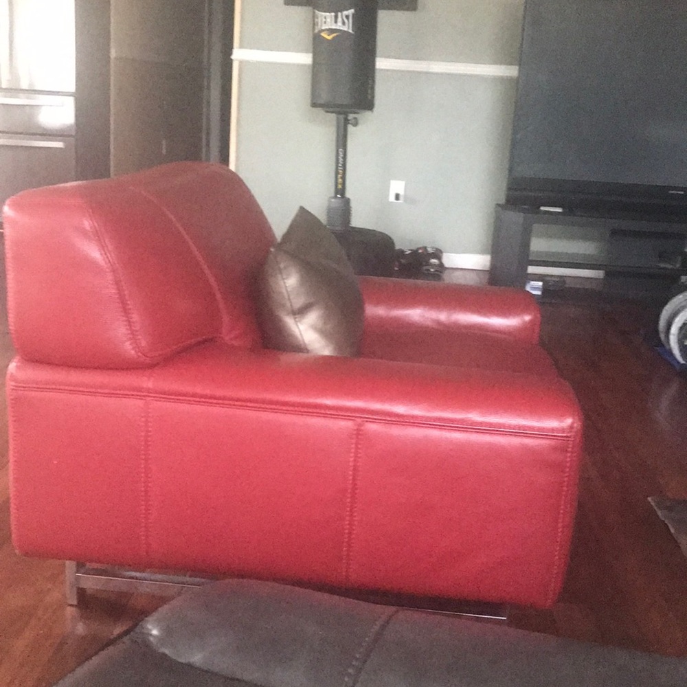 Two leather Bloomingdales chairs and ottoman